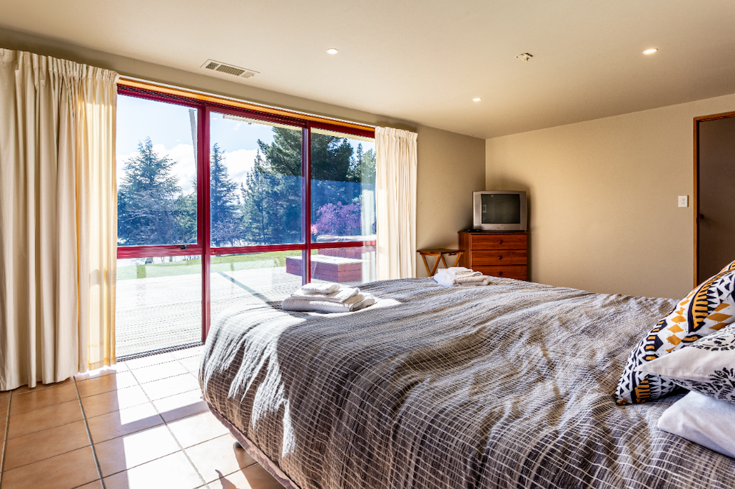 Bedroom with deck views